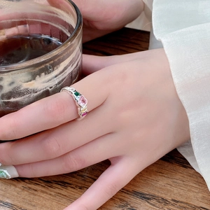 Detail of irregular S925 silver ring with colorful heart-shaped zircon stones