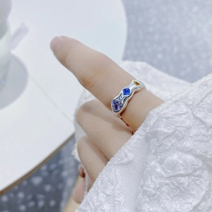 Detail of S925 sterling silver ring featuring irregular texture and colorful zircons