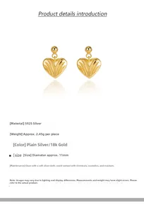 Macro view of S925 sterling silver heart earrings with textured 18k gold finish