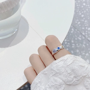 Macro view of S925 silver irregular wavy ring with colorful inlaid zircon gemstones
