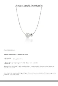 Detail of S925 sterling silver snake chain necklace with pearl and metal ball pendant