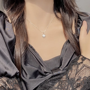 925 silver heart pendant necklace with beads on fine chain shown on black lace