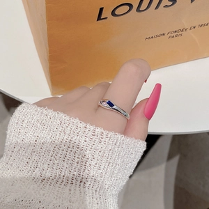Detail of S925 silver ring featuring asymmetrical blue and pink rectangular gemstones