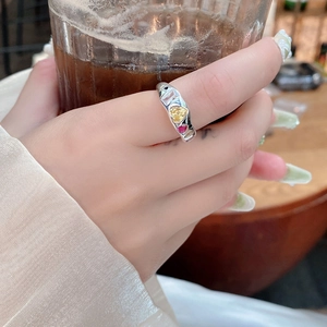 S925 sterling silver ring with irregular wave design and colorful heart-shaped zircon stones
