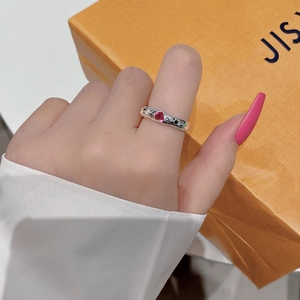 925 silver geometric ring with red heart zircon and star moon motifs on orange background