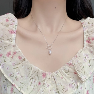 Baroque pearl necklace with S925 sterling silver chain and OT toggle clasp on female model