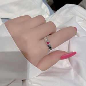 S925 silver ring with pink heart zircon and black letters on model's hand