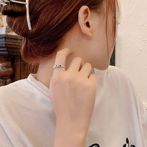 S925 sterling silver geometric ring with purple zircon and black star, worn on finger