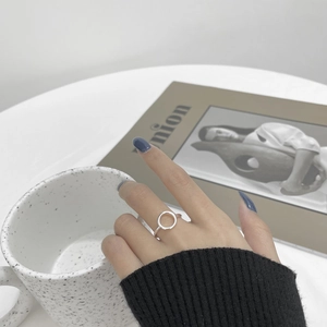 S925 sterling silver hollow circular ring shown on hand with minimalist aesthetic style