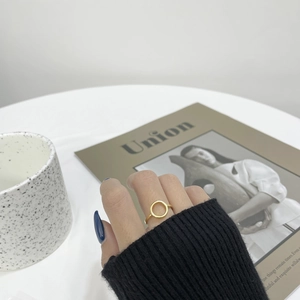 Minimalist S925 sterling silver hollow round ring in gold finish on model finger