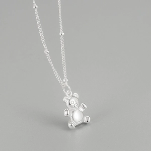 Collana con ciondolo orso in argento sterling S925 con catena a sfere su grigio