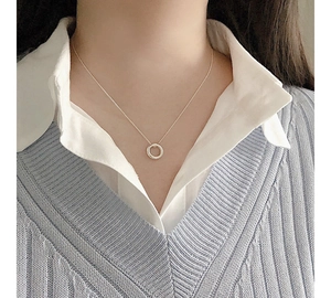 Minimalist S925 sterling silver irregular circle pendant necklace worn on a woman neck