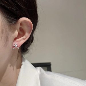 Cute S925 sterling silver teddy bear stud earrings shown on a model for a stylish look