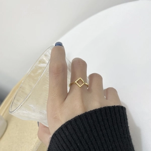Minimalist gold S925 silver geometric rhombus ring shown worn for a chic lifestyle look