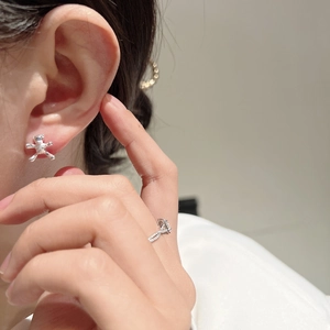 Close-up of a 3D silver bear stud earring in S925 sterling silver on model ear