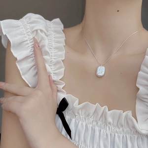 Minimalist S925 silver necklace featuring a square baroque pearl pendant on a female model