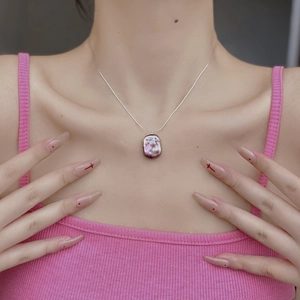 Detailed view of square purple baroque pearl pendant on a thin silver S925 necklace