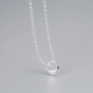 Minimalist S925 sterling silver bead chain necklace featuring a polished donut pendant