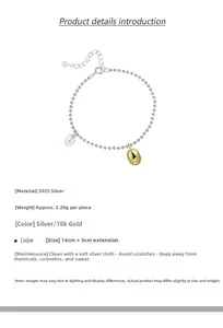 Detail of S925 sterling silver beaded bracelet with baroque pearl and 18k gold charm