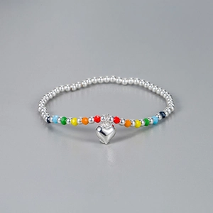 925 silver rainbow beaded bracelet with a polished heart pendant on a gray background