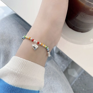 Handmade 925 sterling silver rainbow beaded bracelet with a polished heart pendant charm