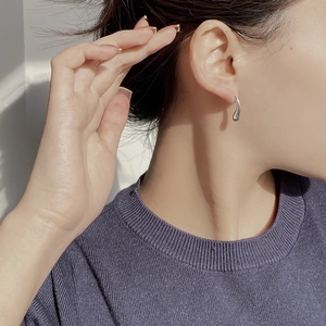 Elegant S925 sterling silver water drop earrings shown on model for minimalist style