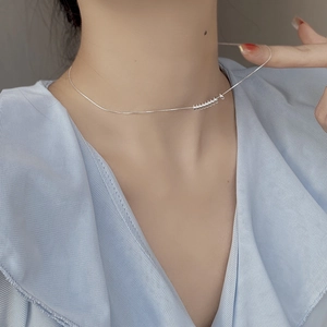 Elegant 925 sterling silver beaded necklace with round rings on a delicate snake chain