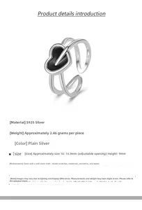 Macro shot of S925 sterling silver double-layer ring with black enamel heart detail