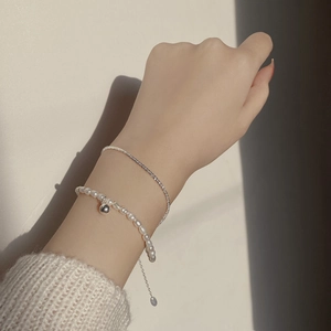 Close-up of double-layer S925 sterling silver bracelet with natural freshwater pearls