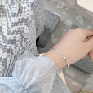 Minimalist 925 sterling silver geometric square link bracelet shown on a female wrist