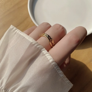 Minimalist double layer gold twisted ring with cross design and polished finish