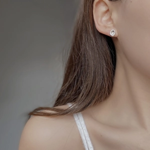 S925 Sterling Silver minimalist hollow oval stud earrings for women on model