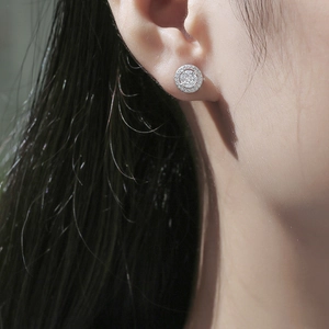 Classic S925 silver halo stud earrings with round moissanite worn by a female model