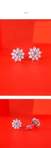 Detailed close-up of sunflower shaped 925 silver stud earrings with moissanite stones