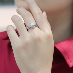 Elegant 925 sterling silver halo ring with moissanite stones on a female hand