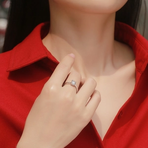 Elegant four-prong S925 silver adjustable ring with sparkling moissanite on a model