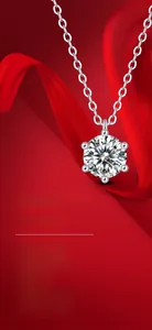 Macro detail of S925 sterling silver six-prong moissanite pendant on elegant red ribbon