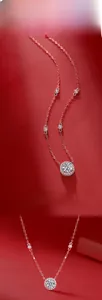 Detail of 925 silver halo moissanite pendant with small diamonds on the chain