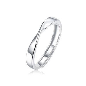Macro shot of minimalist silver ring with twisted Mobius design and polished finish