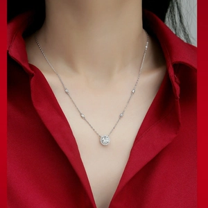 925 silver moissanite halo pendant necklace shown on model with red background