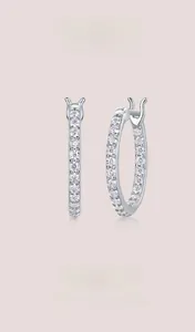 Close-up of S925 sterling silver hoop earrings with shimmering pave-set moissanite stones