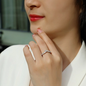 Elegant 925 sterling silver V-shaped crisscross ring featuring micro-pave moissanite stones