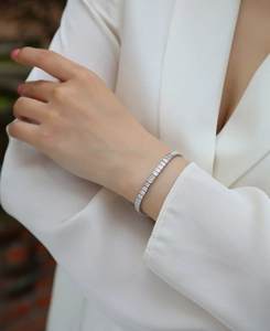 Close-up of S925 sterling silver tennis bracelet with princess cut moissanite stones
