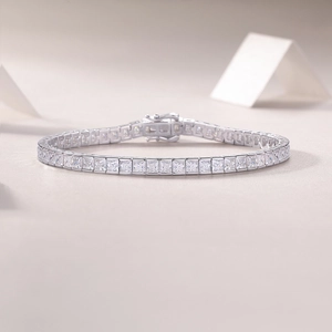 Close-up of S925 silver tennis bracelet with princess cut stones and secure box clasp