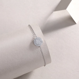 Detailed close-up of a S925 silver moissanite bracelet with a halo pendant design