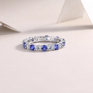 Macro detail of S925 sterling silver stamp and blue sapphire zircon eternity ring