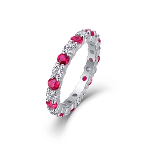 Close-up of S925 sterling silver eternity ring with red and white gemstones in claw setting