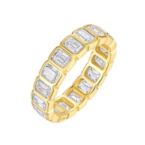 Luxurious 18K gold emerald cut moissanite eternity ring with channel setting on white background