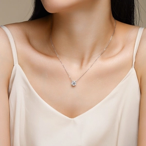 Elegant 925 sterling silver moissanite pendant necklace worn by a female model