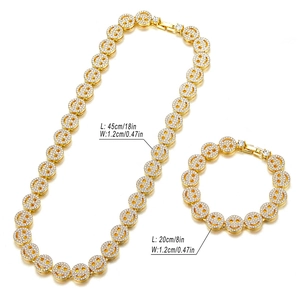 Golden 12mm Cuban link chain set with iced out smiley faces for necklace and bracelet